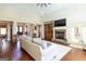 Open living area includes hardwood floors, fireplace, and built-in shelving unit at 145 Carrington Ln, Brooks, GA 30205