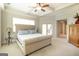 Main bedroom with tray ceiling, ceiling fan and access to the patio at 145 Carrington Ln, Brooks, GA 30205