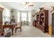 Office space with a ceiling fan, a desk with a laptop, and some windows at 145 Carrington Ln, Brooks, GA 30205