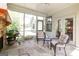 Relaxing sunroom featuring tile flooring and outdoor access, creating a seamless transition between indoor and outdoor spaces at 145 Carrington Ln, Brooks, GA 30205