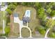 Aerial view of Loganville, Georgia property with circle driveway, patio, in-ground pool and wooded perimeter at 2351 Rabbit Farm Cir, Loganville, GA 30052