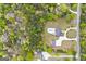 Aerial view of Loganville, GA property with manicured backyard, in-ground pool, and mature trees at 2351 Rabbit Farm Cir, Loganville, GA 30052