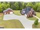 Beautiful aerial view of the brick home, detached garage and meticulously landscaped yard at 2351 Rabbit Farm Cir, Loganville, GA 30052