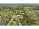 Aerial view of property showing house, pool and detached garage surrounded by trees at 2351 Rabbit Farm Cir, Loganville, GA 30052