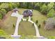 Stunning brick home with long driveway, separate garage and meticulous landscaping on large lot at 2351 Rabbit Farm Cir, Loganville, GA 30052