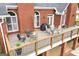 Spacious outdoor deck with a stone fire pit, grill, table, and chairs for entertaining at 2351 Rabbit Farm Cir, Loganville, GA 30052