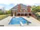 Large backyard with a swimming pool, patio and outdoor dining areas, perfect for outdoor fun at 2351 Rabbit Farm Cir, Loganville, GA 30052