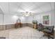 Spacious basement area with tiled floors, a ceiling fan and a large window at 2351 Rabbit Farm Cir, Loganville, GA 30052