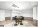 Basement dining area featuring a modern glass table and pendant lighting at 2351 Rabbit Farm Cir, Loganville, GA 30052