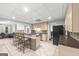 Basement kitchen offers bar seating and a view to a game area at 2351 Rabbit Farm Cir, Loganville, GA 30052