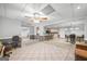Open-concept basement with tiled floors, brick accents, and bar seating at 2351 Rabbit Farm Cir, Loganville, GA 30052
