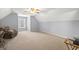Upstairs bedroom with neutral carpet and gray walls has an inviting atmosphere at 2351 Rabbit Farm Cir, Loganville, GA 30052