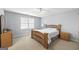 Comfortable bedroom features a ceiling fan, light gray walls, and carpet flooring at 2351 Rabbit Farm Cir, Loganville, GA 30052
