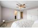 Bright bedroom with ceiling fan, double door closet, and ensuite bathroom entrance at 2351 Rabbit Farm Cir, Loganville, GA 30052
