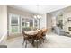 Bright dining room area with natural light and traditional chandelier lighting at 2351 Rabbit Farm Cir, Loganville, GA 30052