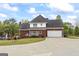 Brick house with a spacious backyard, featuring a deck, inground pool, and ample greenery at 2351 Rabbit Farm Cir, Loganville, GA 30052