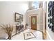 Inviting foyer with marble flooring and natural light, complemented by elegant decor and a stained-glass door at 2351 Rabbit Farm Cir, Loganville, GA 30052