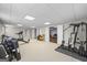 Bright basement home gym with a variety of equipment and easy access to the rest of the house at 2351 Rabbit Farm Cir, Loganville, GA 30052