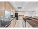 Finished kitchen with stainless steel appliances, light wood cabinets and dark countertops at 2351 Rabbit Farm Cir, Loganville, GA 30052