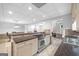 Finished kitchen with stainless steel range, dark countertops, and adjacent dining and living spaces at 2351 Rabbit Farm Cir, Loganville, GA 30052