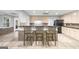The basement features a kitchen island with bar seating and wooden cabinetry at 2351 Rabbit Farm Cir, Loganville, GA 30052