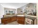 A spacious kitchen features a large countertop, modern sink, stainless steel appliances, and a cozy dining area at 2351 Rabbit Farm Cir, Loganville, GA 30052