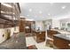 Spacious kitchen with stainless steel refrigerator, kitchen island with gas cooktop, and tile flooring at 2351 Rabbit Farm Cir, Loganville, GA 30052