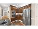 A kitchen with wood cabinets, stainless steel appliances, and granite countertops at 2351 Rabbit Farm Cir, Loganville, GA 30052