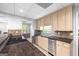 Well-lit kitchen featuring updated stainless steel appliances, granite countertops, and tiled backsplash at 2351 Rabbit Farm Cir, Loganville, GA 30052