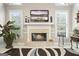 Close up view of the living room fireplace and mantel with bright natural lighting at 2351 Rabbit Farm Cir, Loganville, GA 30052