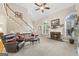 Open living room with vaulted ceilings, fireplace and staircase creates a welcoming and airy atmosphere at 2351 Rabbit Farm Cir, Loganville, GA 30052