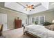 Comfortable main bedroom featuring carpet floors and a vaulted ceiling with ceiling fan at 2351 Rabbit Farm Cir, Loganville, GA 30052
