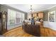 Elegant office with hardwood floors, custom built-ins, and large windows for natural light at 2351 Rabbit Farm Cir, Loganville, GA 30052