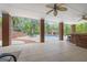 Open-air covered patio provides a view of the sparkling pool, pool house and outdoor seating area at 2351 Rabbit Farm Cir, Loganville, GA 30052