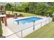 Inviting backyard with fenced swimming pool, patio furniture and lovely landscaping is great for entertaining at 2351 Rabbit Farm Cir, Loganville, GA 30052