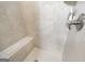 Tiled shower showcasing neutral tile design, a built in seat, and metallic fixtures at 2351 Rabbit Farm Cir, Loganville, GA 30052