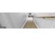 Carpeted stairway with wooden handrail, provides access to the upper level at 2351 Rabbit Farm Cir, Loganville, GA 30052