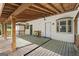 Expansive back porch with a ceiling fan and wooden floors, perfect for outdoor living at 180 Paces Dr, Fayetteville, GA 30215