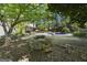 Spacious backyard with an in-ground pool and a covered patio, perfect for outdoor entertaining at 180 Paces Dr, Fayetteville, GA 30215