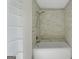 Bathroom featuring a tiled tub with a shower, providing a space for relaxation at 180 Paces Dr, Fayetteville, GA 30215
