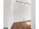 Bedroom with a track lighting and beautiful hardwood floors, providing a comfortable and inviting space at 180 Paces Dr, Fayetteville, GA 30215
