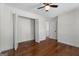 Bedroom with hardwood floors and a closet, with a ceiling fan enhancing comfort at 180 Paces Dr, Fayetteville, GA 30215