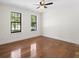 Bedroom showcasing hardwood floors and two windows that let in plenty of light at 180 Paces Dr, Fayetteville, GA 30215