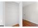 Bedroom closet with hardwood floors and ample shelving for storage at 180 Paces Dr, Fayetteville, GA 30215