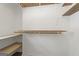 Walk-in closet with wooden shelves at 180 Paces Dr, Fayetteville, GA 30215