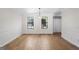 Dining room featuring hardwood floors, neutral walls, and decorative hanging lighting at 180 Paces Dr, Fayetteville, GA 30215