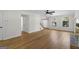 Open floor plan with hardwood flooring, fireplace, and staircase at 180 Paces Dr, Fayetteville, GA 30215