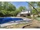 Backyard pool with a diving board and spa area, perfect for outdoor entertainment and relaxation at 180 Paces Dr, Fayetteville, GA 30215