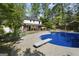 A backyard pool with diving board complements the home and outdoor deck, creating a serene retreat at 180 Paces Dr, Fayetteville, GA 30215