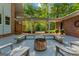 Charming outdoor patio area with a fire pit and seating, perfect for entertaining guests at 4383 Pool Rd, Winston, GA 30187